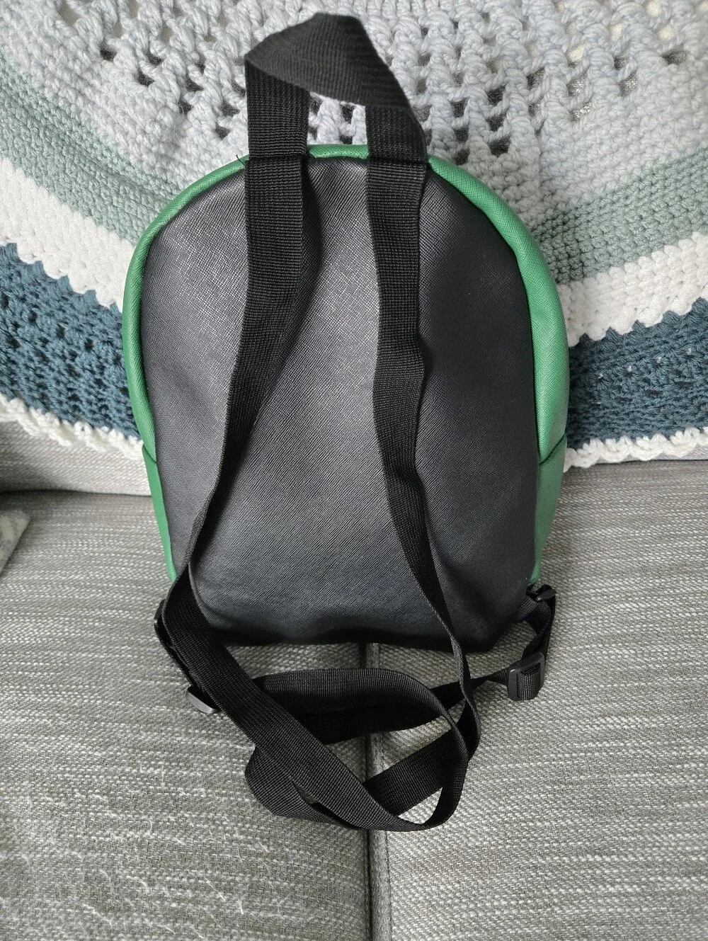 This green and black Friends Central Perk faux leather mini backpack